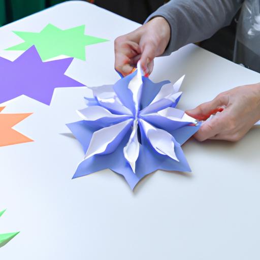 A person making a snowflake out of paper by folding it in intricate patterns